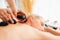 Hot stone massage at spa salon in luxury resort. Quiescent