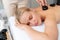 Hot stone massage at spa salon in luxury resort. Quiescent