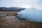 Hot sulfuric steam vent spewing sulphur steam in the hot sulfuric and geothermal area of Namaskard in Myvatn/Iceland.