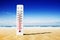Hot summer day. Celsius and fahrenheit scale thermometer in the sand. Ambient temperature plus 39