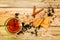 Hot Tea in glass cup with cinnamon sticks tea leaves and cookies on wooden table, flat lay