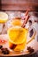 Hot tea with lemon, anise and cinnamon in glass mugs