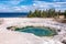 Hot thermal spring Abyss Pool in Yellowstone National Park, West Thumb Geyser Basin area, Wyoming, USA