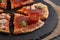 Hot true PEPPERONI ITALIAN PIZZA with salami and cheese. TOP VIEW Tasty traditional pepperoni pizza on board on wooden table with