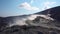 Hot volcanic gas exiting through fumaroles on Vulcano island. Steaming surface of volcano. Blue sky. Lipari Islands