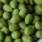 Hot Wasabi Peanuts. Wasabi coated peanuts close-up. Green spicy Japanese snack