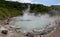 The hot water of Oyunuma pond in the volcanic landscape of Hell Valley Jigokudani