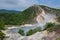 The hot water of Oyunuma pond in the volcanic landscape of Hell Valley Jigokudani