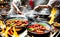 A hot wok with chef in a Chinese kitchen. back view of the chef, Chinese food being cooked in a wok on fire in the Chinese kitchen