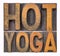 Hot yoga word abstract in wood type