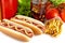Hotdogs with cola,french fries,salad,tomatoes on white