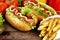 Hotdogs on plate with cola on wooden desk