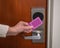 Hotel access key card being swiped by hand