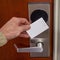 Hotel access key card being swiped by hand