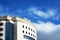 Hotel blue windows against the blue sky