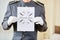 Hotel clerk holding thank you sign