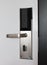 Hotel door with automatic lock for visitor card