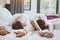 Hotel guests relaxing on the bed in their room, couple traveling