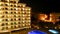 Hotel with illuminated swimming pool at night