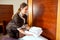 Hotel maid placing fresh towels on the bed