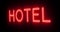 Hotel neon sign above guest house room - 4k
