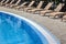 Hotel Poolside Empty Rattan Sunbeds Near Swimming Poll