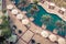 Hotel Poolside with Parasols and Palms