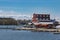 Hotel and restaurant just by the water and blue sky background