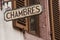 hotel signage on stoned wall with french text Chambre