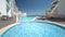 Hotel small swimming pool with sunny reflections timelapse, Sesimbra, Portugal