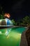 Hotel swimming pool lit at night