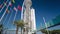 Hotel Tower with palms and flags in the Park of