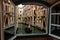 Hotel Window View of Venice Canals, Buildings and Gondolier.