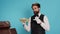 Hotel worker holds restaurant wall sign