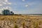 Hotels and dried plants on the beach during the winter season in Cadzand