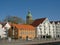 Hotels and restaurants with Valberg historical watchtower behind in downtown Stavanger, Norway