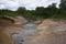 Hotsprings and mudpots between the vegetation of Uzon Caldera