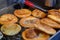 hotteok, Korean Syrup-filled Pancake : Fermented flour dough shaped into balls, filled with a spoonful of brown sugar, and pan-