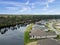 Houes and Screen Porches Line the Bank of a Small Pond in an American Neighborhood from Above Aerial