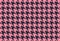 Houndstooth seamless pattern on pink background.