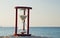 Hourglass on the beach of the Red Sea