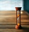 Hourglass closeup stand on a wooden floor