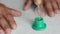 Hourglass and hands of an elderly man on the table. The concept of passing time, diligence, wisdom. Memories of the past, fleeting