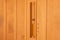 Hourglass hanged on wooden wall of sauna. Sandglass timer