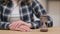 Hourglass Next to Female Hands Waiting Gesture, Close up