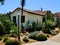 House Adobe style with beautiful landscape of cacti and other blooming flowers