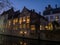 House along canal at night in Bruges, Belgium