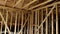 House attic under construction walls and ceiling material in wooden frame