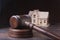 House Auction, auction hammer , symbol of authority and Miniature house . Courtroom concept.