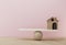 House a balance scale in equal position on wooden table and pink background. financial management, depicts short term borrowing